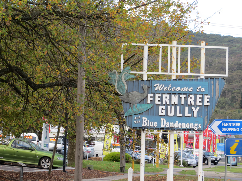 Sign says "Welcome to Ferntree Gully and the Blue Dandenongs"